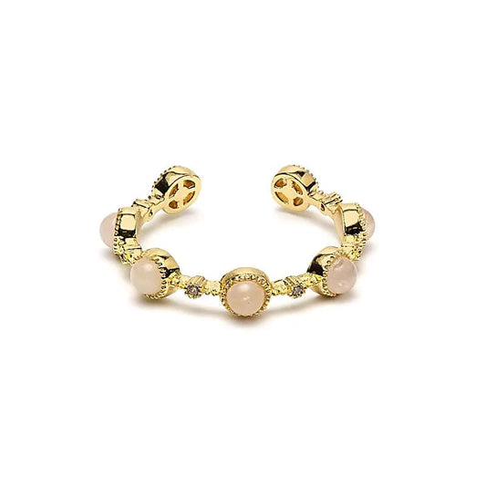 Goudkleurige verstelbare ring met ronde lichtroze rozenkwarts steentjes en open ringband