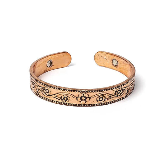 koper armband met bloemmotief