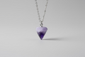 Kleine paarse amethist pendel van 2 cm met punt en kettinkje