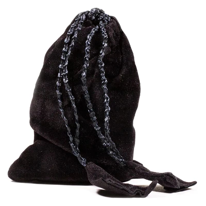 Zeven chakra-edelstenen in fluwelen zakje met sanskriet symbolen